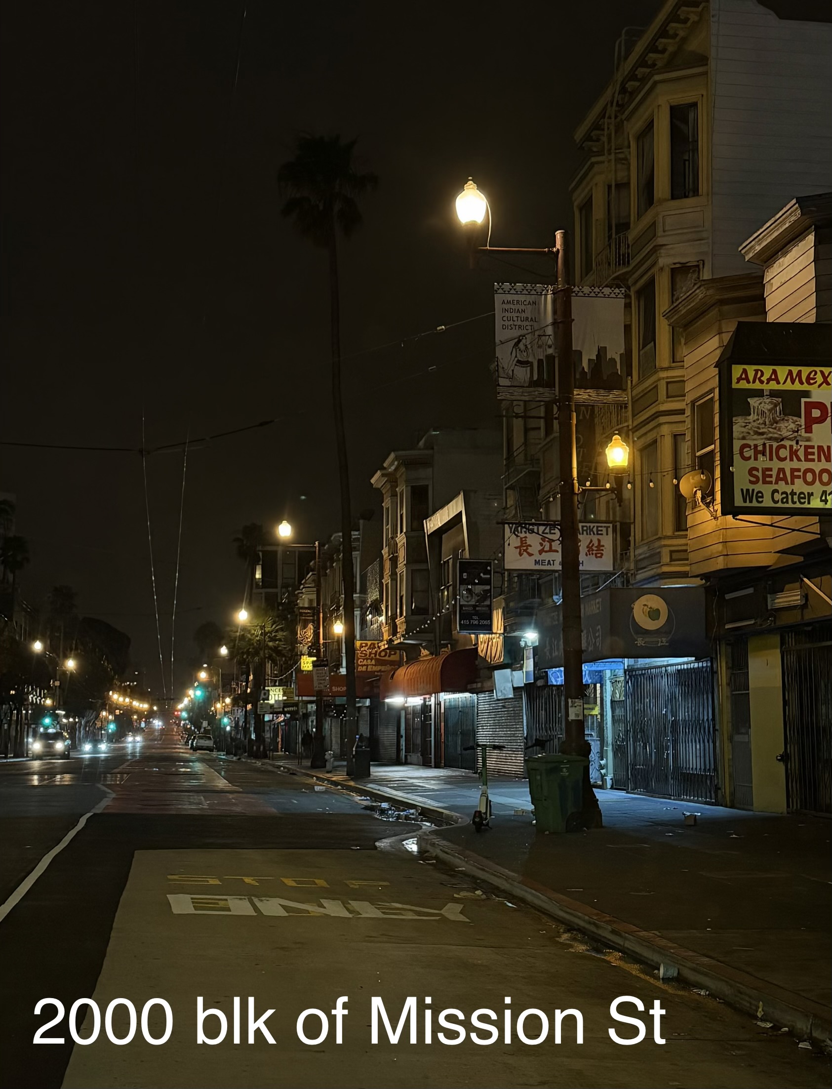 2000 block of Mission Street at night with streetlights